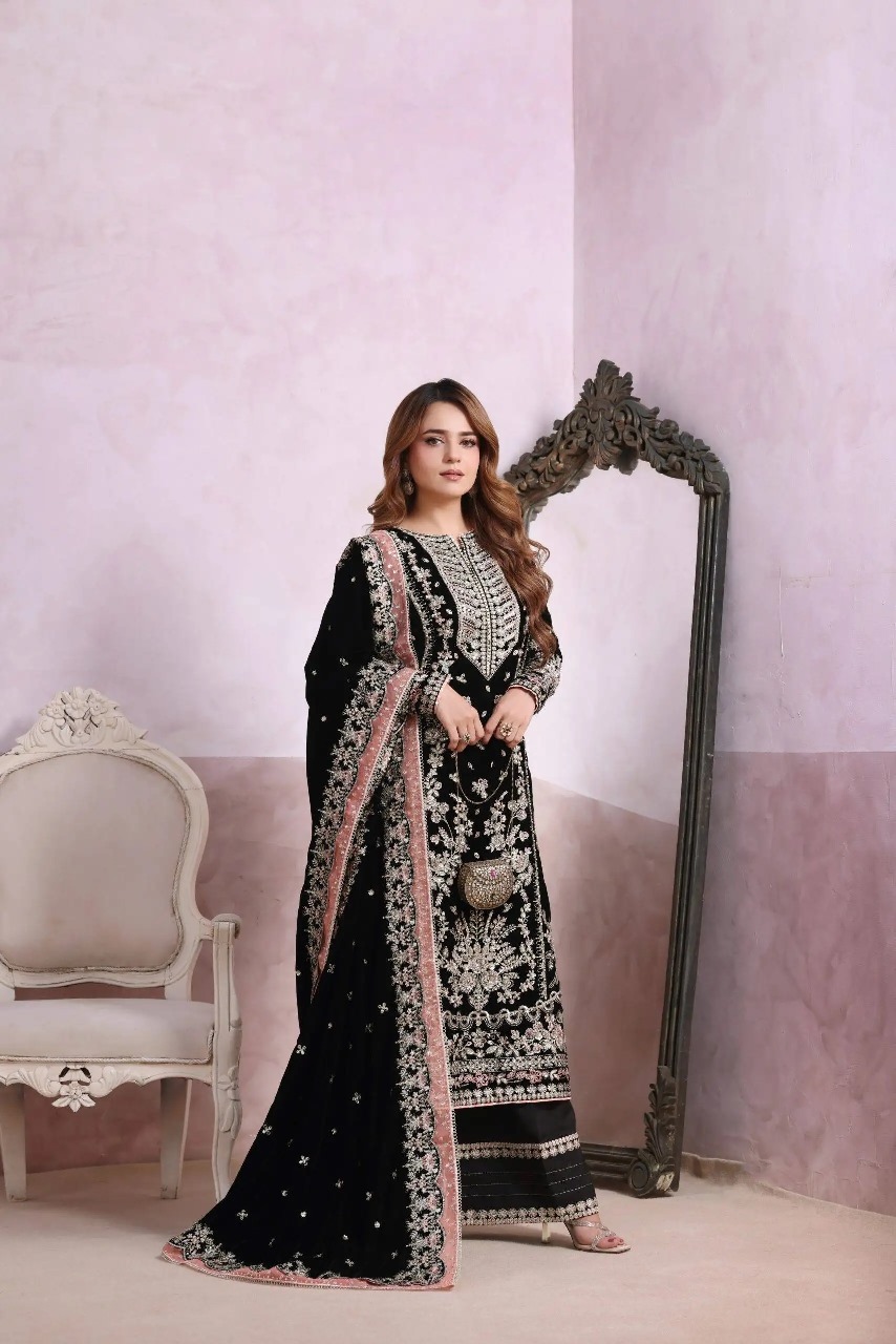 Luxury premium velvet suit featuring fully heavy sequence & zari embroidery, chiffon embroidered dupatta, and silk trouser with patch detailing — perfect for formal & festive wear.