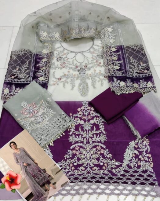 Maria B organza suit featuring tie & dye embroidery with handwork, cutwork daman, and a beautifully detailed dupatta with tassels.